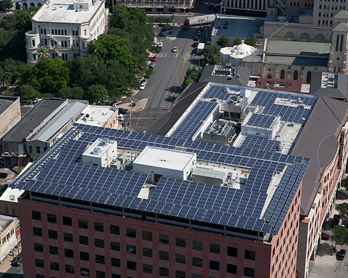 A photo of solar panels on top of a roof